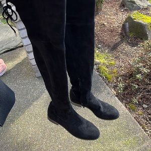 black swayed over the knee flat boot